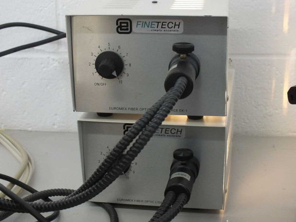 Two Finetech Euromex EK-1 fiber optic light source illuminators stacked, with flexible fiber optic light guide cables attached