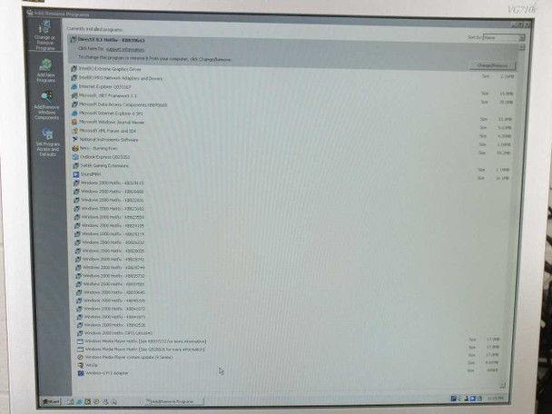 PC monitor screen showing Windows XP Add/Remove Programs panel with Fineplacer EM02B4.2 software and associated drivers/components listed