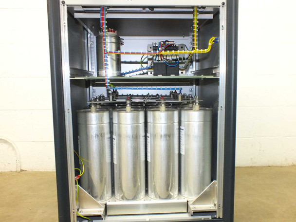 Interior view of Berger PSS10 showing bank of four large Electronicon MKP capacitors plus upper wiring compartment with transformer and control electronics