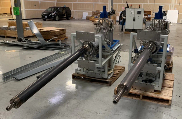 Riber Jet 40K two selenium cracker source assemblies side by side on pallets in warehouse showing dual linear tube arrays