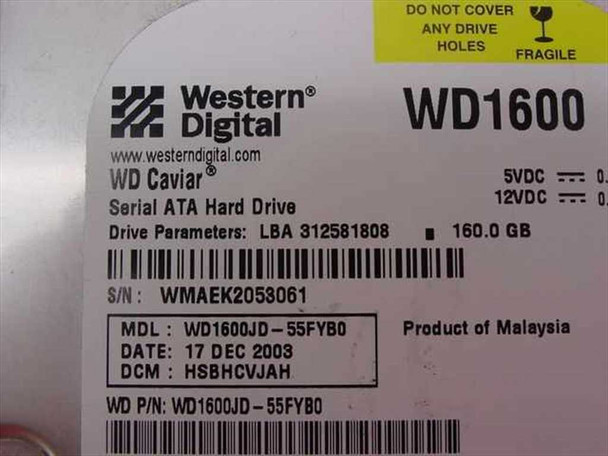 Western Digital WD1600JD-55FYB0 label closeup showing WD Caviar, 160GB, Serial ATA, manufacture date 17 Dec 2003, Product of Malaysia