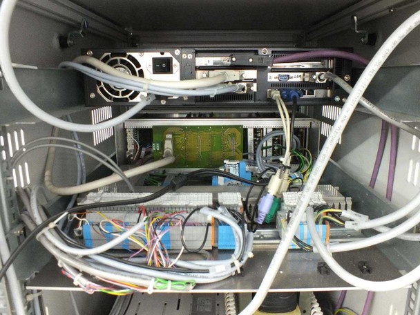 Amtec XRF 940V internal detail — top rack section with PC board, VGA and serial connectors visible on rear of embedded computer