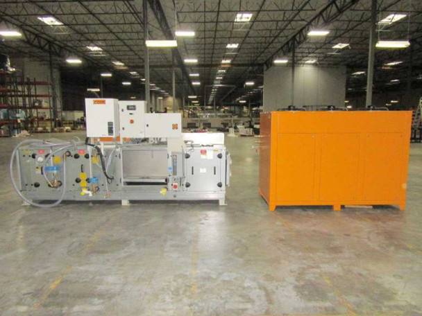 Deltatherm WT-Gruppe HYD11-100 heating cooling unit and RKV 11.2 orange chiller cabinet on warehouse floor, full system overview