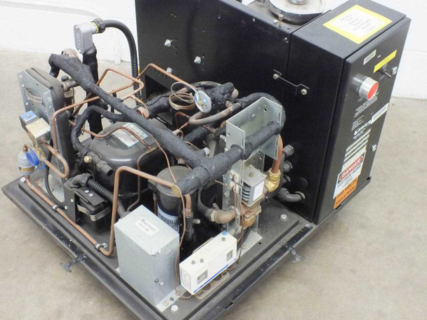 Affinity FWE-005C-CD38CA chiller – three-quarter interior view showing compressor, copper refrigerant plumbing, electrical enclosure, and fluid valve components