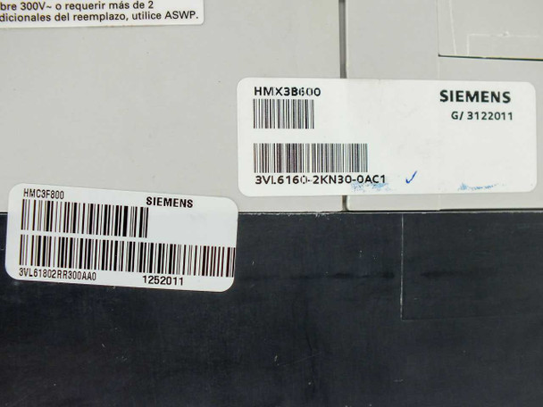 Siemens HMX3B600 breaker label closeup showing model HMX3B600, Siemens logo, part 3VL6160-2KN30-0AC1, and date G/3122011; adjacent label HMC3F800 / 3VL61802RR300AA0 dated 1252011