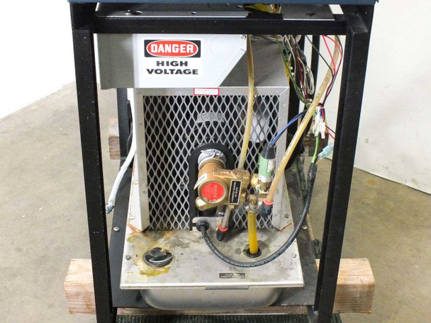 Accu-Weld 5100 lower interior – DANGER HIGH VOLTAGE warning label, brass solenoid valve, and mesh ventilation panel