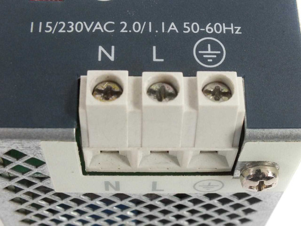 Sola SDN 4-24-100 — bottom close-up of 3-position AC input terminal block labeled N, L, and ground (PE), rated 115/230VAC 2.0/1.1A 50-60Hz