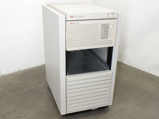 HP 9000 E35 server in HP C2785A rack enclosure — three-quarter front view showing upper HP Systems bezel and lower server bay with open card cage area