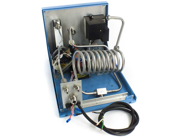 Johnson Matthey HP-100 interior with top cover open — stainless steel coiled tubing, transformer, plumbing manifold, and wiring visible; main palladium cell absent