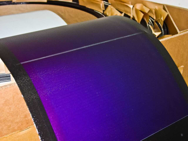 Close-up of Uni-Solar PVL-128 panel surface showing purple-to-black amorphous silicon cells and black frame edge