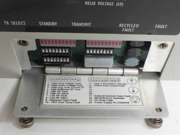 CPI VZC-6964A4 fault indicator panel close-up showing LED array labeled HELIX VOLTAGE (kV), TX SELECT, STANDBY, TRANSMIT, RECYCLED FAULT, FAULT, and fault code legend card listing faults 1–20 including Helix Over Voltage, TWT Over Temp, and Power Supply Arc Detected