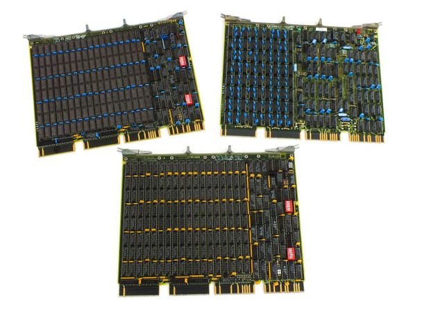 DEC PDP-11 QBus memory card lot — two MSV11 M7551 cards (blue capacitors, top) and one MSV11-PF M8067 card (yellow capacitors, bottom) laid out together