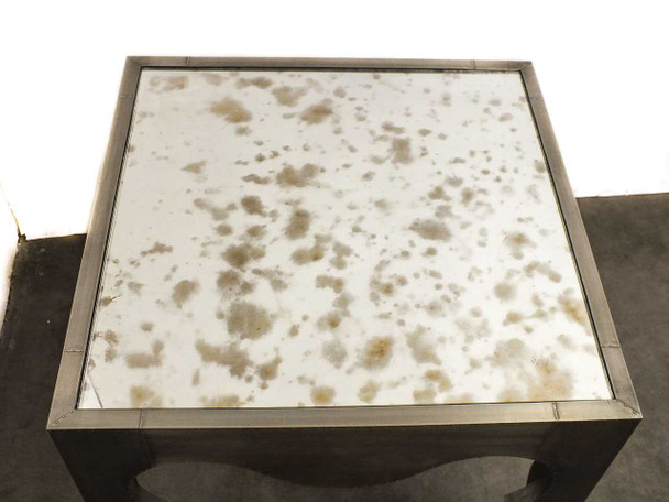 Artistica Van Cleef 125-260 – close-up top-down view of antique mirror glass surface showing characteristic foxing and patina pattern