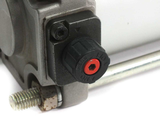 SMC CDBA2F80-250 end lock mechanism close-up – black rotary lock knob with red indicator and lock/release markings visible