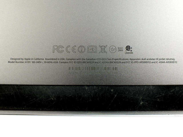 Apple iMac A1311 bottom label showing model number A1311, 100-240V 50-60Hz 4.0A power rating, FCC/CE certifications