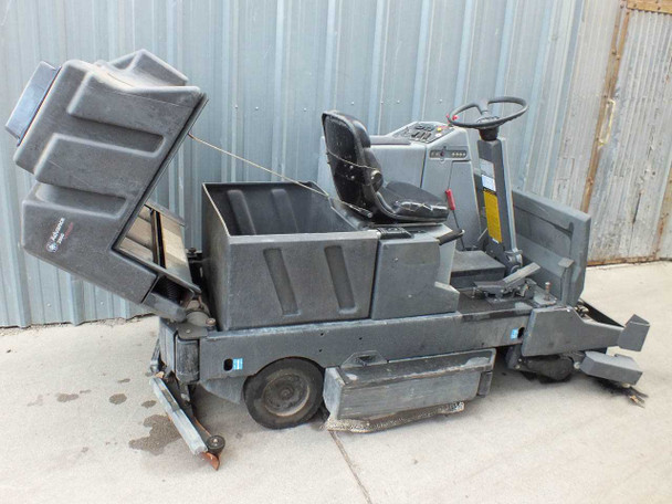 Nilfisk-Advance 3800 – right-side view with recovery tank lid raised, showing interior tank and scrubber body