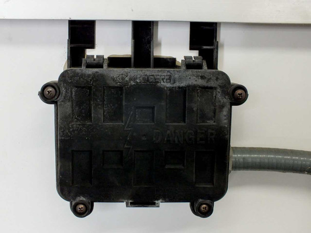 Kyocera KC120-1 junction box close-up – black molded enclosure with DANGER label and output lead