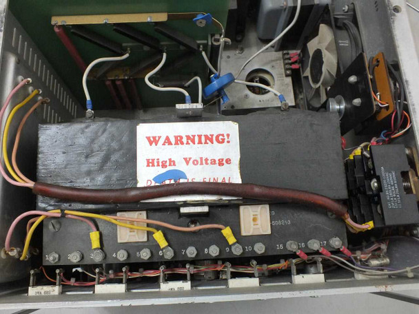 Interior close-up of Sloan Five/Ten power supply high-voltage section with numbered terminal strip and warning label