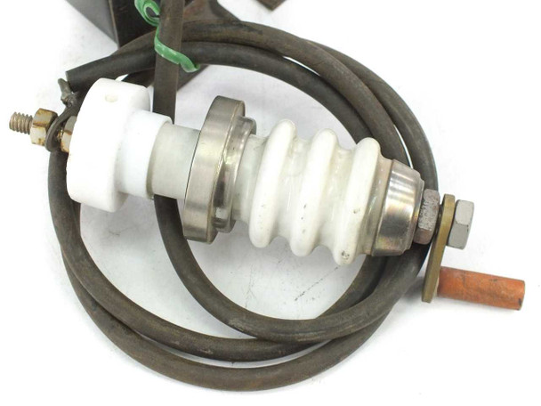 Close-up of GE 9T61Y2025 porcelain high-voltage output lead insulator with copper electrode and rubber cable