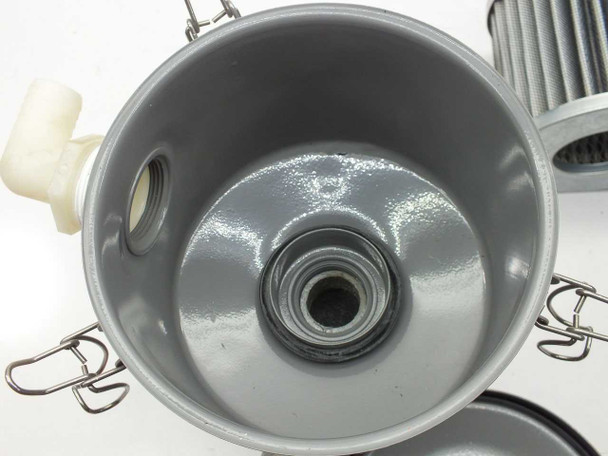 Solberg CSL-849-125HC filter housing – interior bowl view with element removed, showing inlet port seat, drain fitting, and gray coated interior