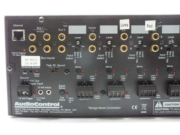 AudioControl D4400 Director rear panel detail — left half showing Ethernet jack, Bus 1/Bus 2 RCA inputs, zone 1-5 level controls, input select switches, mono switches, 12V trigger, and zone labels including Living and Pool