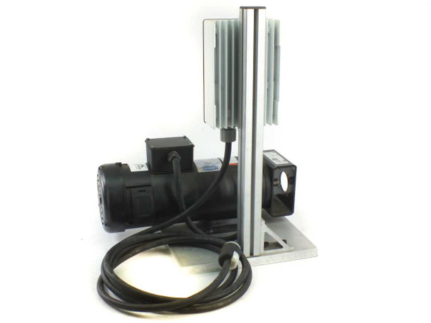 Leeson DC motor and Seepex pump on aluminum base plate showing rear/side angle with aluminum vertical post, heat sink fins, and coiled black power cable