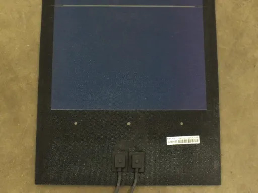 End section of Uni-Solar PVL-136 flexible solar panel showing amorphous silicon cells and dual MC3 connectors
