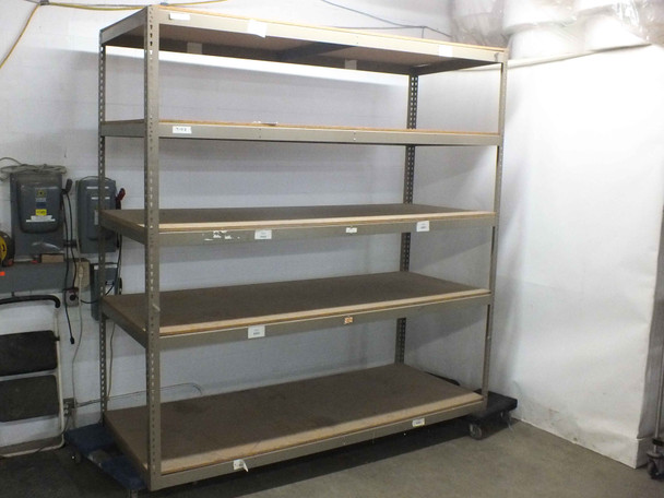 Heavy duty boltless rivet shelving unit 96x36x96 with 5 particle board shelves — full front view in warehouse setting