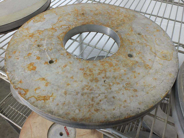Top view of a 16-inch Lapmaster lapping plate showing heavy surface rust and oxidation with center bore