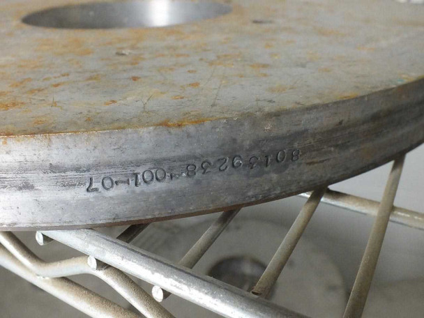Edge/rim view of a Lapmaster lapping plate showing stamped part number 8013226338-07-10 (or similar) on the rim
