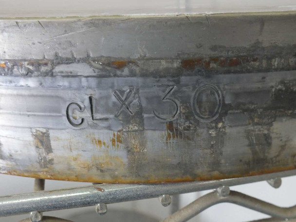 Rim detail of a Lapmaster lapping plate showing stamped code 'cLX 30' on the edge