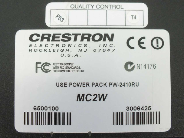 Crestron MC2W bottom label showing model MC2W, part number 6500100, serial 3006425, PW-2410RU power requirement, FCC and CE markings, Rockleigh NJ USA