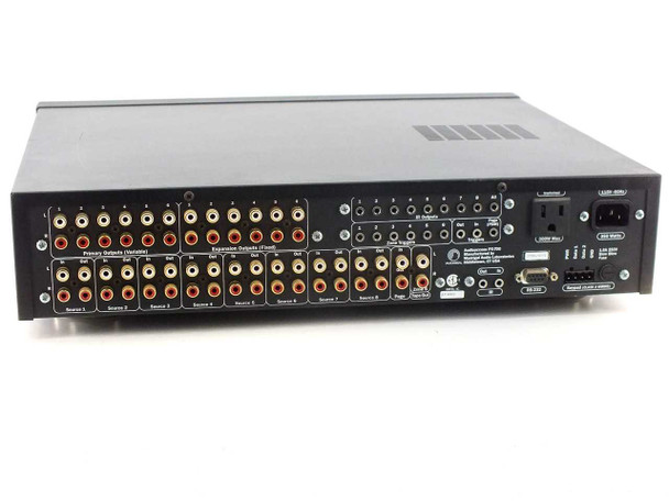 Audio Access PX-700 rear panel showing primary RCA outputs, expansion RCA outputs, 8 source RCA inputs, RS-232 port, IR in/out, trigger outputs, and AC inlet