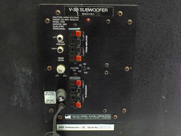 M&K V-3B rear panel close-up showing V-3B Subwoofer label, Made in U.S.A., input/output connections, filter settings, and serial number label