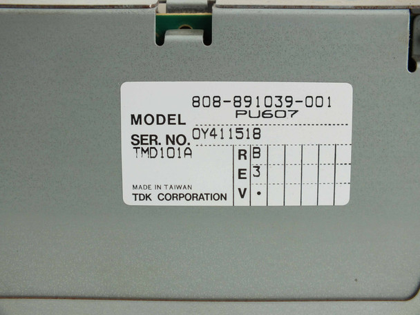 TDK power supply label — Model 808-891039-001, PU607, TMD101A, Serial No. OY411518, Rev B/E3, Made in Taiwan, TDK Corporation