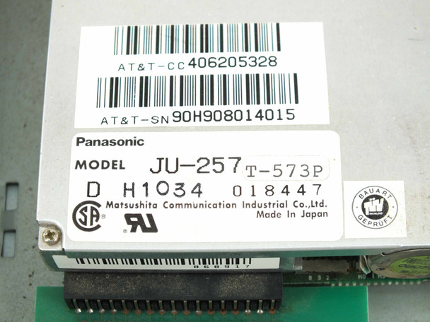 Panasonic JU-257 T-573P 3.5-inch floppy drive label — AT&T-CC 406205328, AT&T-SN 90H908014015, Model JU-257 T-573P, Made in Japan, Matsushita Communication Industrial Co.