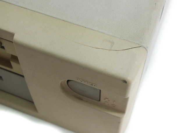 NEC PowerMate 286 Plus — close-up of top-right corner showing case crack and yellowing near power button