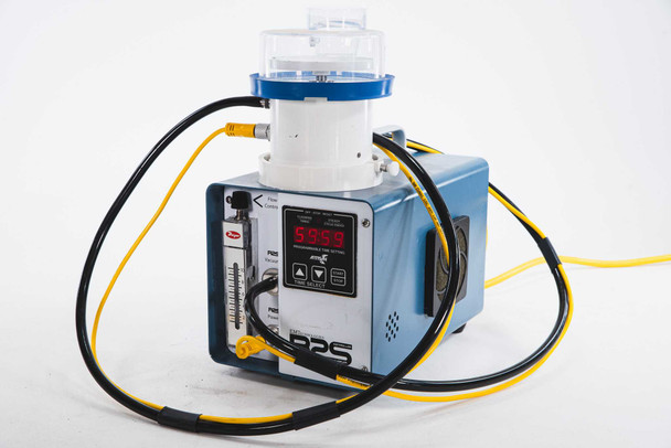 EM Technologies R2S-C.002 microbial air sampler — three-quarter front-left view with digital display reading active, polycarbonate dome assembly mounted, and yellow cables routed to controller