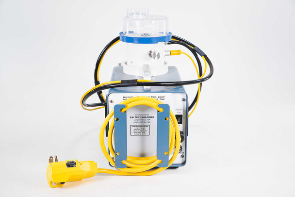 EM Technologies R2S-C.002 microbial air sampler — rear view of R2S controller base showing EM Technologies manufacturer label, model label, and yellow NEMA 5-15 power cord