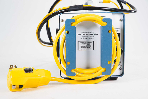 EM Technologies R2S-C.002 — close-up of rear EM Technologies manufacturer label and model/serial number label on blue controller housing with yellow power cord and NEMA plug
