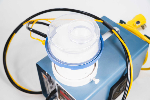 EM Technologies R2S-C.001 — close-up top view of impaction-type sampler head with clear acrylic dome lid and blue mounting collar seated on top of the unit