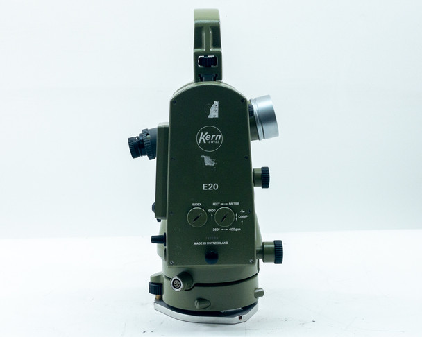 Kern E20 Theodolite right-side panel showing model designation 'E20' and control panel with INDEX and FEET/METER dials — Made in Switzerland label visible