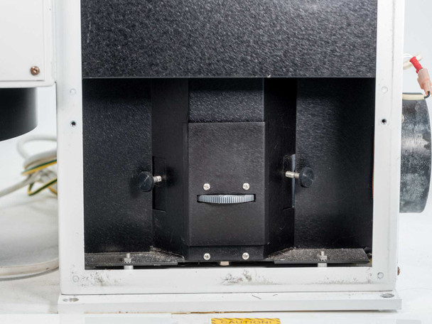 OAI 0130-041-04 – interior lower compartment view showing lamp carriage, adjustment knob, and mounting rails inside the black-lined lamp chamber