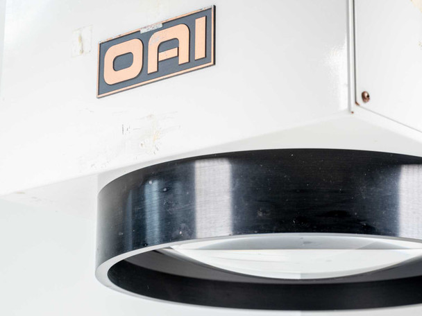 OAI 0130-041-04 – close-up of OAI badge and black circular aperture ring with reflective interior visible