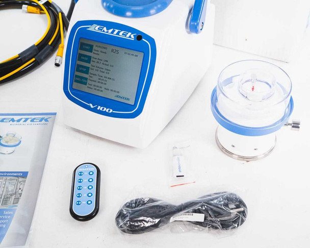 EMTEK V100 sampler front panel with LCD touchscreen showing RS2 sampling head data, RS2 head alongside remote control and power cord
