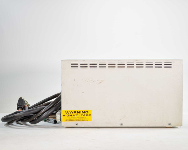 Unitek Miyachi Phasemaster III – rear view showing high-voltage warning label and bundled welding cables with multi-pin connectors