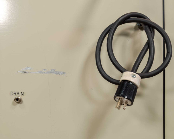 Jun-Air 2000-25M – rear lower panel showing brass fittings and warning label regarding circuit fuse requirements