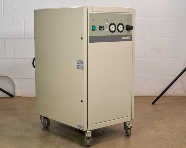 Jun-Air 2000-25M oil-free cabinet air compressor – three-quarter front-right view showing full cabinet profile and caster base