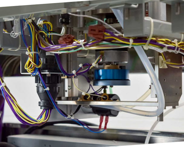 Underside internal mechanism view showing small DC motors, a blue toroidal component, wiring harnesses, plastic tubing, and mechanical linkage assembly for the lid/dome actuator