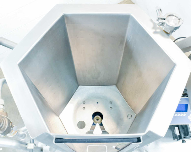 Interior top-down view of ASI imPULSE 100L stainless steel mixer vessel showing hexagonal bottom, mixing impeller/agitator blade, and port fittings